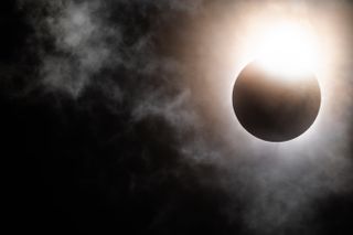 The moon begins its descent below the sun&#039;s horizon during a total solar eclipse on April 08, 2024 in Brady, Texas.