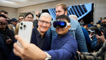 Tim Cook taking selfie with Vision Pro user