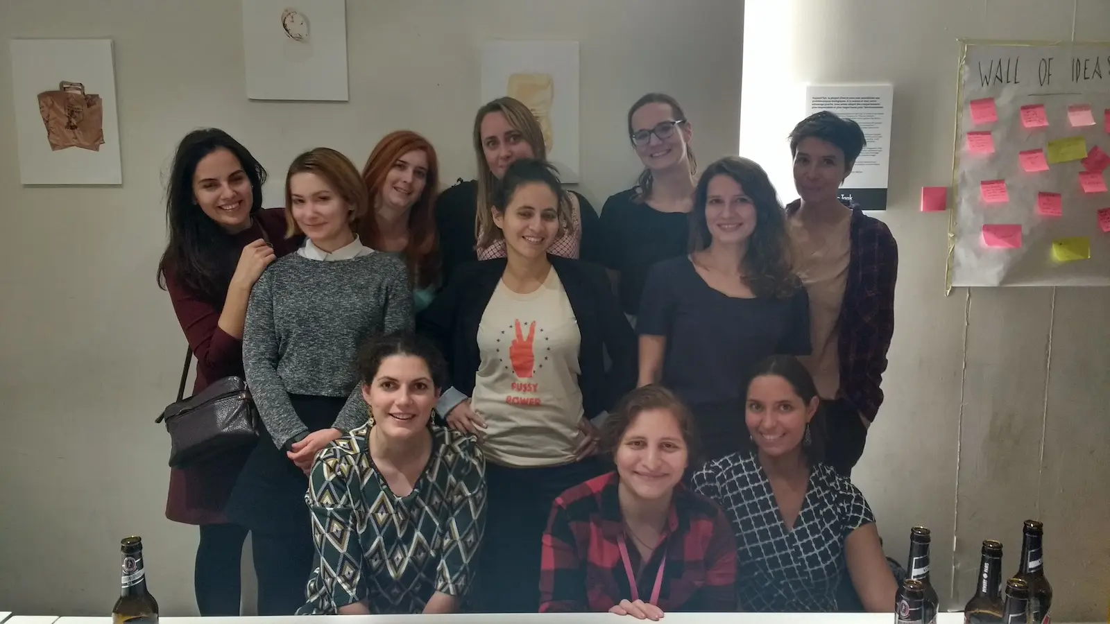 Team of women posing for a camera.