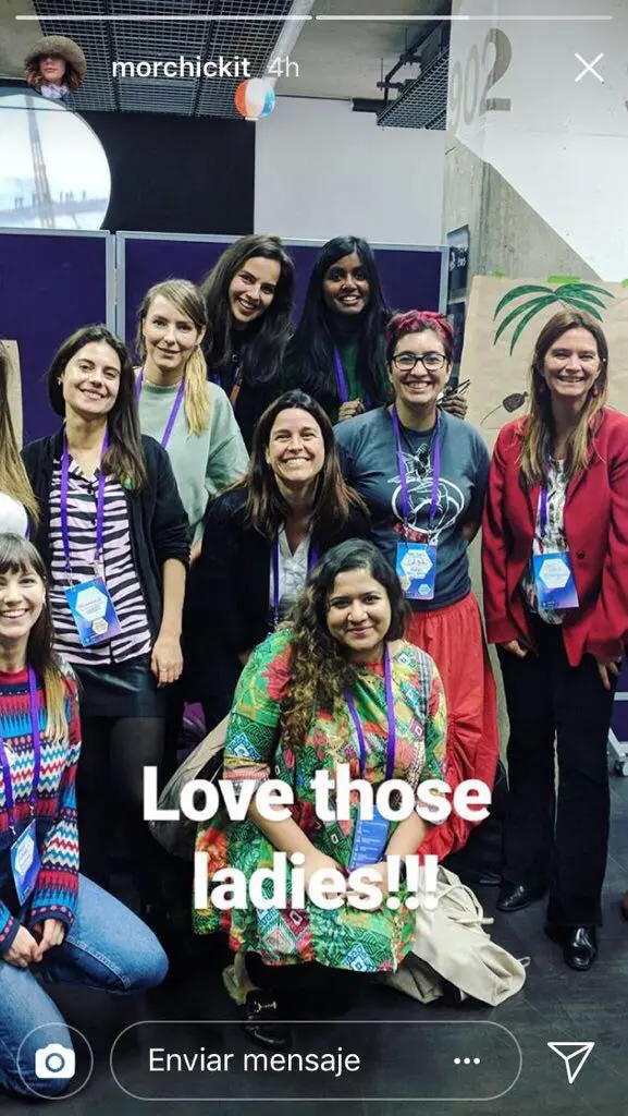 Team of women posing for a camera.