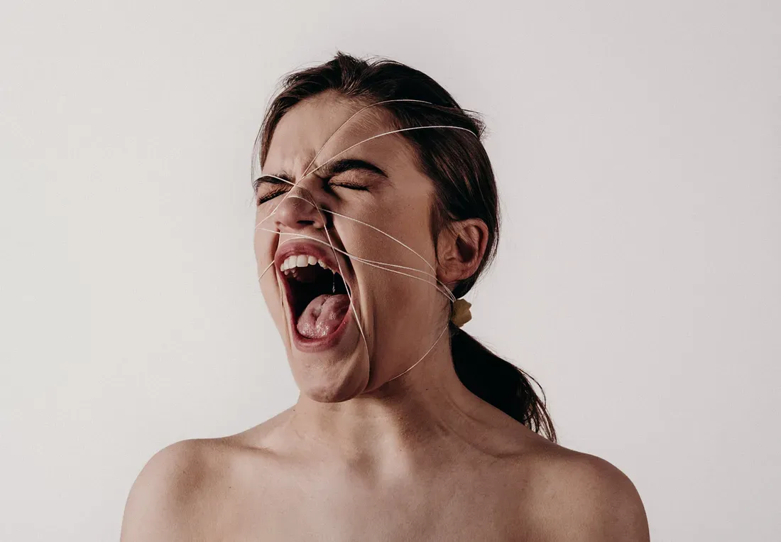 A woman screaming.