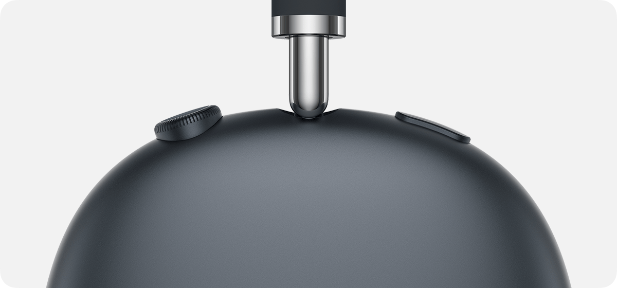 Digital Crown and noise control button on AirPods Max. The controls are on the top of the right ear cup.