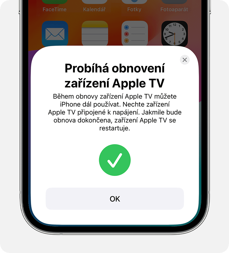 iPhone s oznámením, že se Apple TV obnovuje