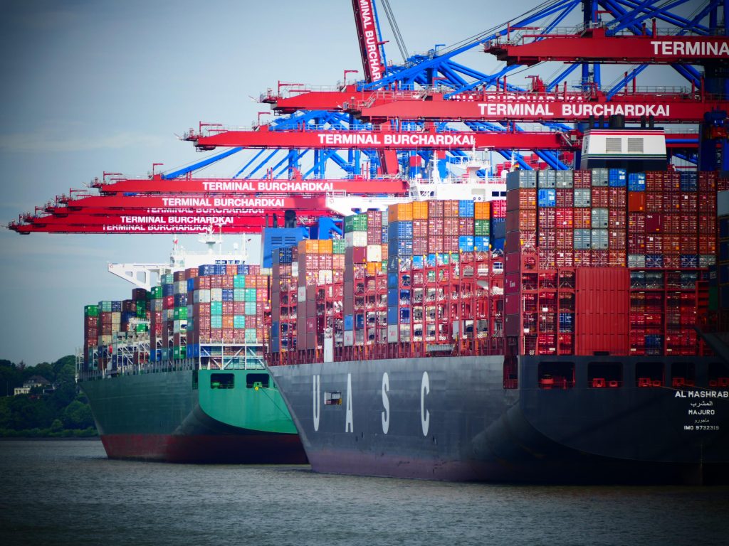 Photo: Container Cargo at the Shipping Harbour of the Port of Hamburg, Germany. Credit: myLAM / Alamy Stock Photo. 