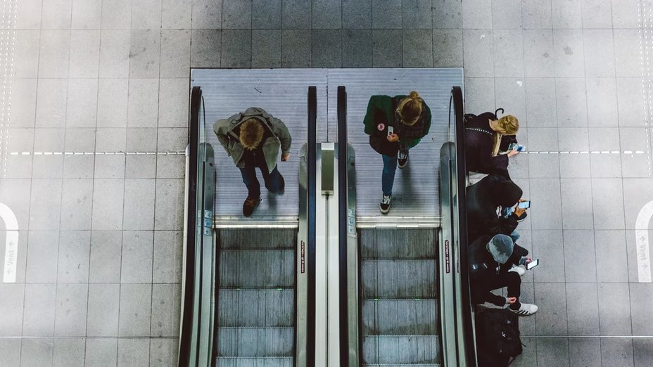 Photo: People using their phones in the city, Denmark. Credit: Shane Rounce via Unsplash.