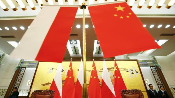 Photo: Poland and Chinese flags remain on the podium after a singing ceremony attended by countries presidents at the Great Hall of the People in Beijing November 25, 2015. Credit: REUTERS/Damir Sagolj.