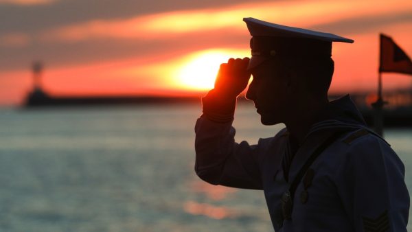 Photo: SEVASTOPOL, RUSSIA - JUNE 12, 2021: A serviceman stands by the Black Sea as he attends a celebration of Russia Day. Credit: Alexei Pavlishak/TASS