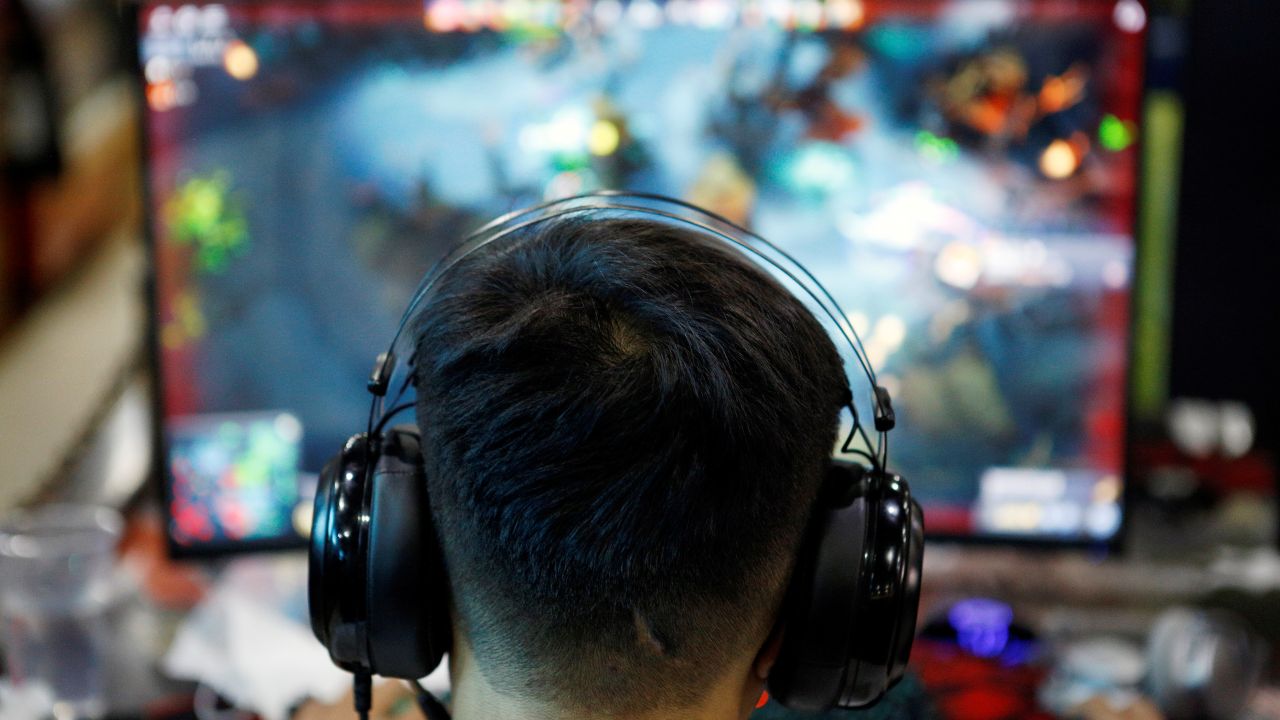 Photo: A man plays online game on a computer at an internet cafe in Beijing, China August 31, 2021. Credit: REUTERS/Florence Lo