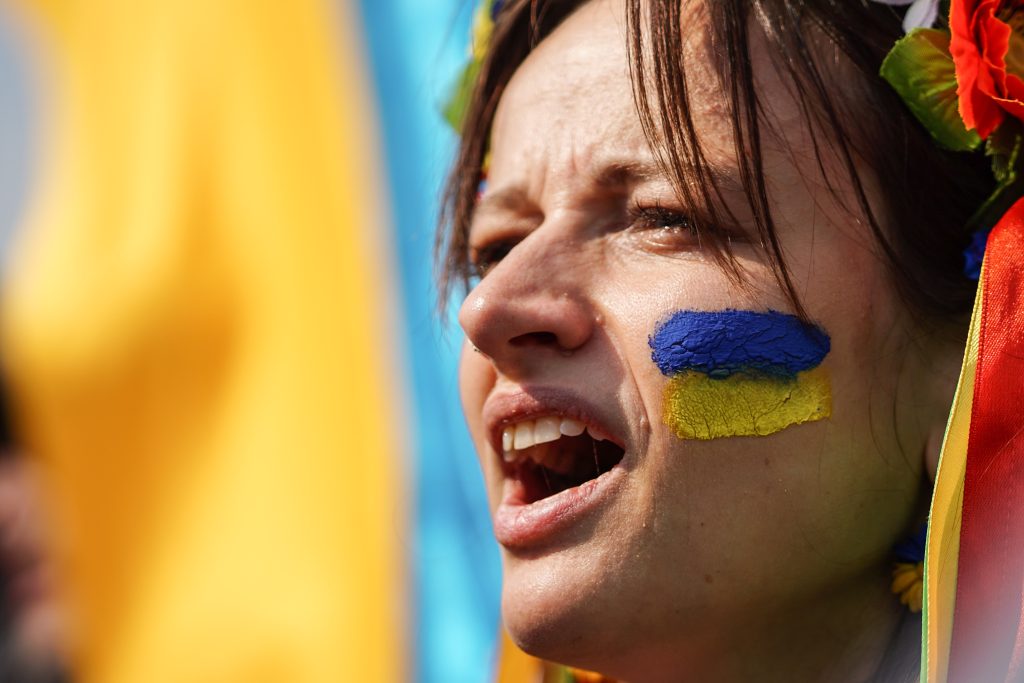 Photo: A woman seen shouting slogans during the demonstration. Ukrainians gathered to protest against Russia's invasion of Ukraine in Istanbul, Turkey. Explosions and gunfire were reported around Kyiv on the second night of Russia's invasion of Ukraine, which has killed scores and prompted widespread condemnation from US and European leaders. Credit: Photo by Ibrahim Oner / SOPA Images/Sipa USA