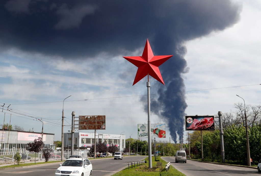 Photo: Smoke rises above a burning oil storage, located on the outskirts of the city, in the course of Ukraine-Russia conflict in Donetsk, Ukraine May 4, 2022. Credit: REUTERS/Alexander Ermochenko