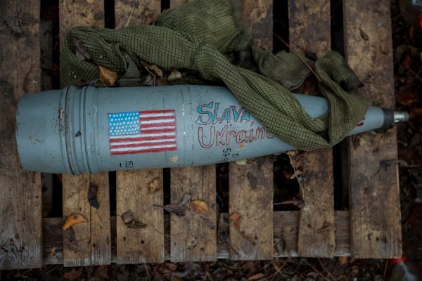 Photo: A shell with a painted American flag appears side of a Giatsint-B howitzer at a position near a frontline, amid Russia's attack on Ukraine, at an undisclosed location in Donetsk region, Ukraine, November 4, 2023. Credit: REUTERS/Alina Smutko