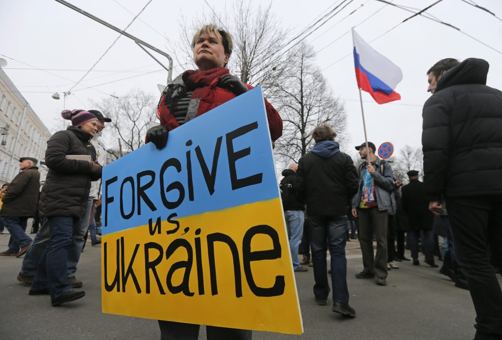 Russia: People take part in an anti-war procession and a rally in Moscow March 15, 2014. Participants, including opposition activists and supporters, protested against the incursions of the Russian army into Ukraine's Crimea, according to organisers. EU diplomats will choose from a long list of 120-130 possible Russian targets for sanctions on Sunday, as pro-Moscow authorities who have taken power in Crimea hold a vote to join Russia in the worst East-West confrontation since the Cold War. Credit: REUTERS/Maxim Shemetov (RUSSIA - Tags: POLITICS CIVIL UNREST MILITARY)