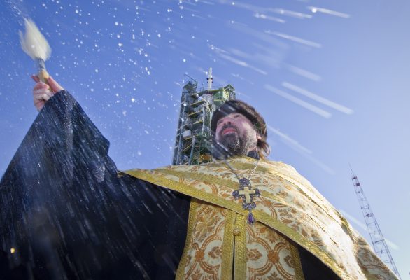 Photo: An Orthodox priest conducts a blessing service in front of the Soyuz TMA-07M spacecraft at the Baikonur cosmodrome December 18, 2012. Soyuz with U.S. astronaut Thomas Marshburn, Russian cosmonaut Roman Romanenko and Canadian astronaut Chris Hadfield is scheduled to fly to the International Space Station on December 19. Credit: REUTERS/Shamil Zhumatov (KAZAKHSTAN - Tags: SCIENCE TECHNOLOGY RELIGION)