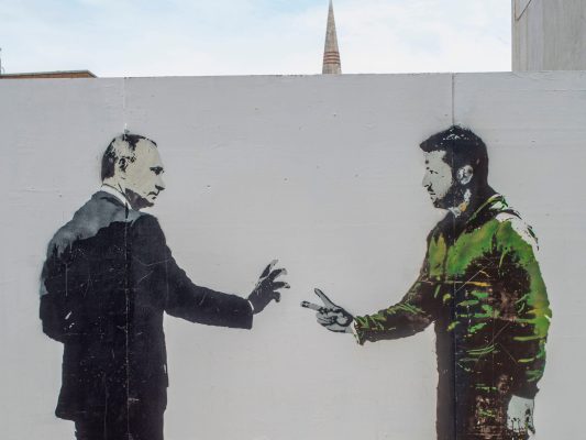 Photo: Graffiti depicts Vladimir Putin and Volodymyr Zelensky who are currently at war following Russia's invasion of Ukraine. Credit: horst friedrichs / Alamy Stock Photo.