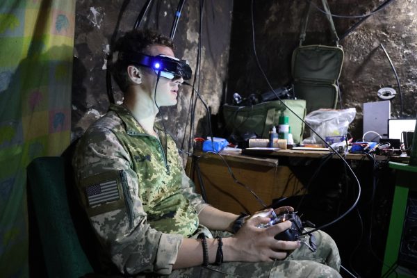 Photo: Yevhenii piloting an FPV drone conducting combat operations. Credit: Photo Courtesy of David Kirichenko.