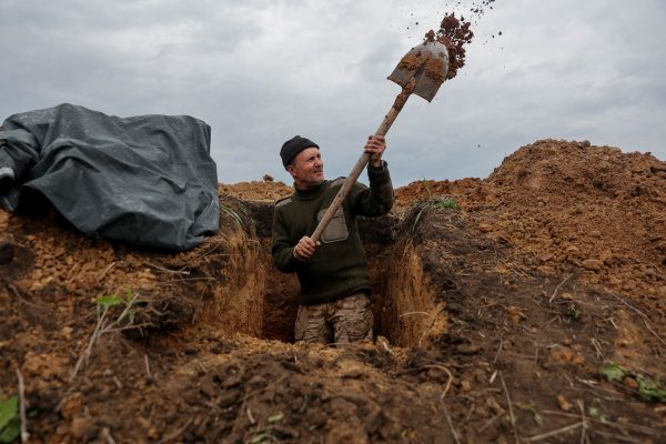 Photo: A Ukrainian serviceman digs a trench at a position, as Russia's attack on Ukraine continues, in Donetsk Region, Ukraine April 18, 2022. Credit: REUTERS/Serhii Nuzhnenko