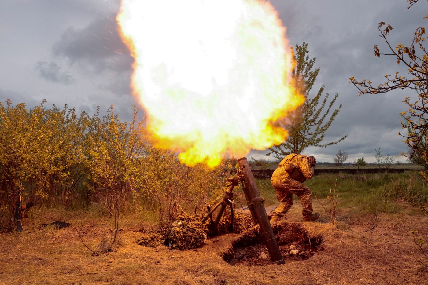 Photo: A Ukrainian serviceman fires with a mortar at a position, as Russia's attack on Ukraine continues, at an unknown location in Kharkiv region, Ukraine May 9, 2022. Credit: REUTERS/Serhii Nuzhnenko