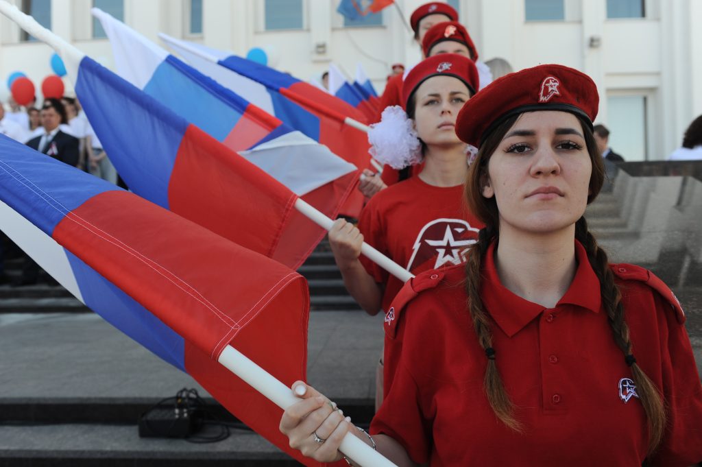 Photo: Girls from the Russian children and youth movement Yunarmiya hold Russian flag during the celebrations of the National Flag Day in the city of Tambov, Russia. Credit: Leo Hall/EYEPRESS.