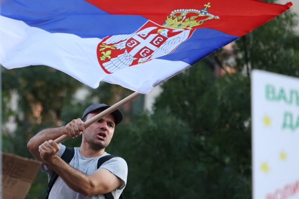 Photo: A man waves a Serbian flag as people attend a protest against Rio Tinto's lithium mining project, in Belgrade, Serbia, August 10, 2024. Credit: REUTERS/Zorana Jevtic