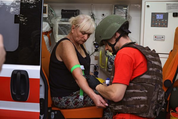 Photo: A medical worker provides aid to a woman injured as a result of Russian shelling with cluster munitions in Derhachi, Kharkiv region, north-eastern Ukraine, on September 8, 2024. Credit: Ukrinform/NurPhoto