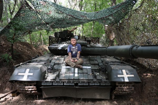 Photo: Bohdan from the 28th Separate Mechanized Brigade sitting atop a Ukrainian T-64 tank posing for a photo. Credit: Courtesy/David Kirichenko.