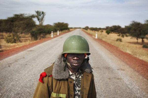 Photo: In Africa, Malian soldier Ousmane Cisse stands guard on an open road outside Sevare, Mali, January 27, 2013. Credit: REUTERS/Joe Penney