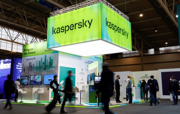 Photo: People walk next to Russian Kaspersky stand during the GSMA's 2022 Mobile World Congress (MWC), in Barcelona, Spain, March 2, 2022. Credit: REUTERS/ Albert Gea