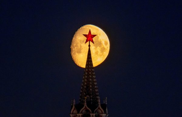 Photo: The moon rises behind a tower of the Kremlin and red star on its top in central Moscow, Russia, March 21, 2024. Credit: REUTERS/Marina Lystseva