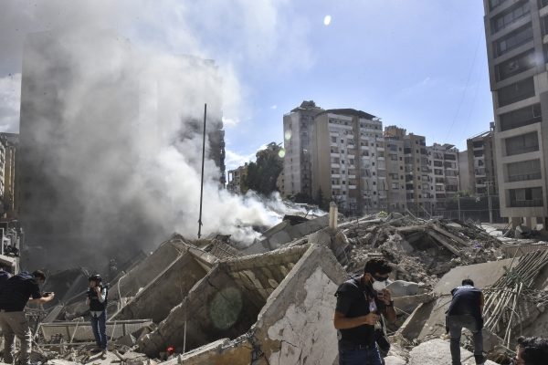 Photo: Smoke rises from a building destroyed by an Israeli airstrike as journalists and local residents visit during a press tour in Beirut, Lebanon, on October 2, 2024. Israel continues airstrikes on Beirut and its southern suburbs as its military announces a ground offensive in Lebanon, part of what it says is a ''limited'' incursion to target Hezbollah forces. Credit: Fadel Itani/NurPhoto.