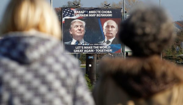 Photo: A billboard showing a pictures of US president-elect Donald Trump and Russian President Vladimir Putin is seen through pedestrians in Danilovgrad, Montenegro, November 16, 2016. Credit: REUTERS/Stevo Vasiljevic