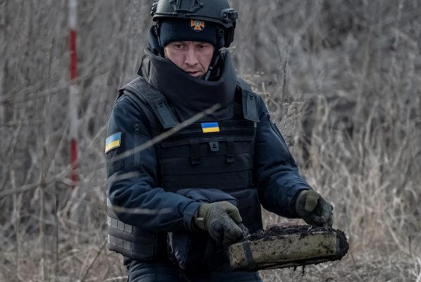 Photo: A sapper of the State Emergency Service carries an anti-tank mine as he inspects an area for mines and unexploded shells, amid Russia's attack on Ukraine, in Kharkiv region, Ukraine March 21, 2023. Credit: REUTERS/Viacheslav Ratynskyi