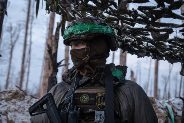 Photo: A Ukrainian soldier spots for enemies in a trench in the Donetsk region. With a lack of ammunition and military personnel, Ukraine is having a hard time on its frontline as the war between Ukraine and Russia continues. Credit: Ashley Chan / SOPA Images.