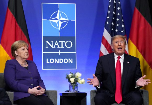 Photo: US President Donald Trump speaks during a bilateral meeting with Germany's Chancellor Angela Merkel at the sidelines of the NATO summit in Watford, Britain, December 4, 2019. Credit: REUTERS/Kevin Lamarque/File Photo