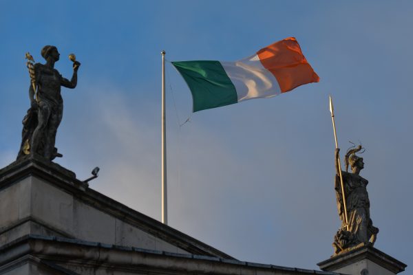 Photo: An Irish tricolor flag seen on the top of the General Post Office in Dublin's city centre. On Wednesday, November 18, 2020, in Dublin, Ireland. Credit: Artur Widak/NurPhoto.