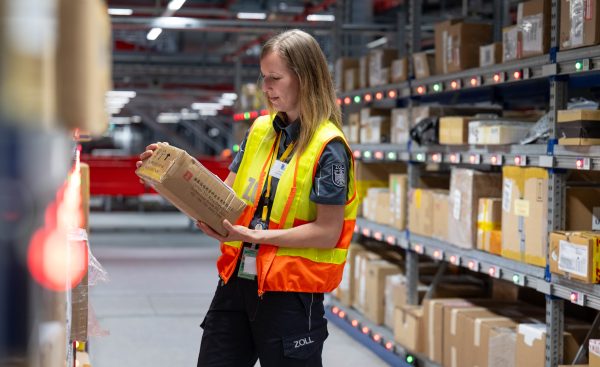 Photo: Julia Christmann from the customs office at Leipzig Airport inspects a parcel at the DHL hub. The security of imported products is one of the criteria that customs scrutinize more closely at the air freight hub. To ensure this security, a combination of labeling and effective controls is used. Credit: REUTERS