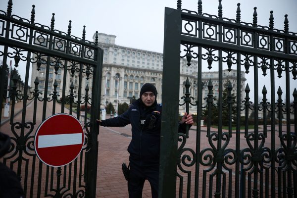 Photo: A Jandarmeria member closes a gate to the Palace of Parliament, after the Romanian top court annulled the result of the first round of the presidential election, in Bucharest, Romania, December 6, 2024. Credit: REUTERS/Louisa Gouliamaki