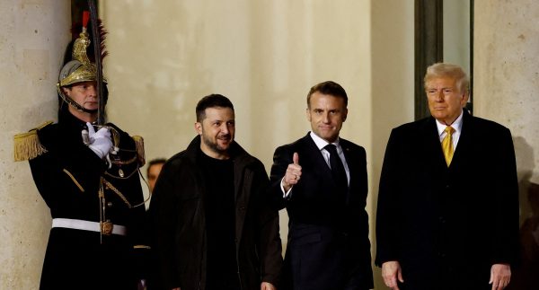 Photo: French President Emmanuel Macron accompanies US President-elect Donald Trump and Ukraine's President Volodymyr Zelenskyy after a trilateral meeting at the Elysee Palace in Paris as part of ceremonies to mark the reopening of the Notre-Dame de Paris Cathedral, five-and-a-half years after a fire ravaged the Gothic masterpiece, France, December 7, 2024. Credit: REUTERS/Christian Hartmann