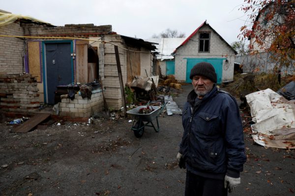 Photo: Myhaylo Yurkiv, 65, stands outside his destroyed home, after he stayed in a bunker for six months during fierce battles under Russian occupation which destroyed every home in the village and cut the village in two by the shelling of the bridge, leaving him now as the only person living on his side of the village, as Russia's invasion of Ukraine continues, in Tsupivka, Ukraine, October 26, 2022. Credit: REUTERS/Clodagh Kilcoyne