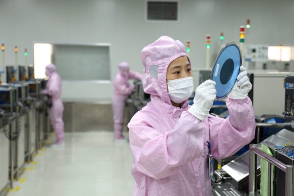 Photo: Workers produce automotive semiconductor products at a workshop of an automotive semiconductor production company in Binzhou, China, on December 25, 2024. Credit: Photo by Costfoto/NurPhoto