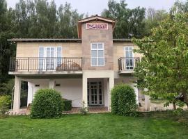 Zaton Guesthouse, hotell i Cholpon-Ata