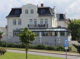 Pension Strandschloss Arielle, hotel con jacuzzi a Börgerende-Rethwisch