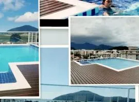 APARTAMENTO PRÓXIMO A PRAIA PISCINA E AREA GOURMET