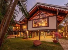 Aranyam Villa by StayVista with Modern wooden interiors, Kidszone, Indoor games & plunge pool