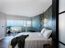 Sea View Stylish 1BR with Balcony by Beachfront Stay