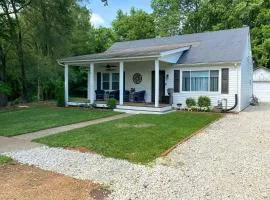 Quaint Creekside Cottage with Porch and Backyard!