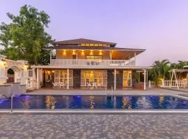 StayVista's Lake La Vie - Tranquil Lake-View Villa Amidst Farmland with Pool and Poolside Gazebo - Proximity to Sula