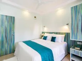 Serene Escape One Bedroom Apartment with AC, Wi-Fi, Gym and 5-Minute Walk to the Beach Cativating Tree and Garden Views