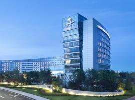 Grand Barony Qingdao Airport Hotel, hotel económico em Qingdao