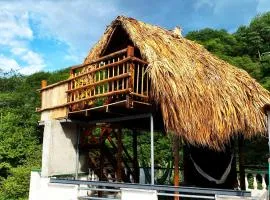 Cabin with balcony and ocean view.