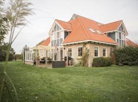 Waddenvilla 18, hótel í Hollum